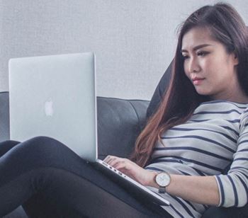 A resident connects to high-speed Internet while working in her apartment unit